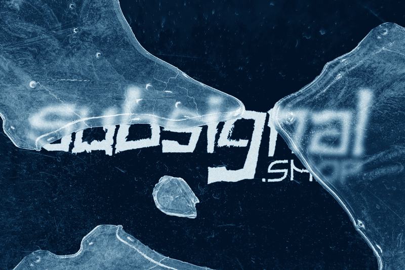 Frosted letters half-hidden under shards of ice on deep navy
